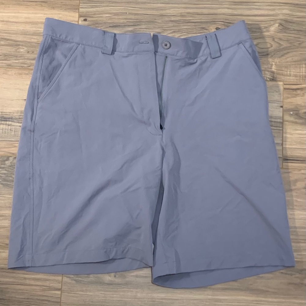Light grey Under Armour men’s golf shorts.